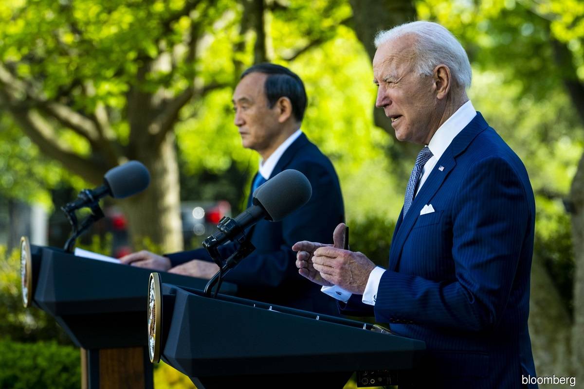 Biden and Japan's Suga project unity against China's assertiveness